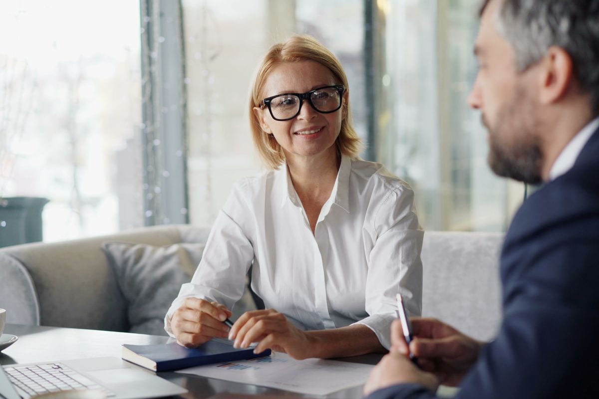 A professional in a one on one conversation with a manager during an internal promotion interview