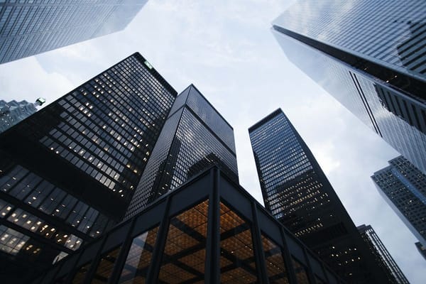 Corporate skyscrapers viewed from below — representing the high-stakes world of McKinsey consulting interviews