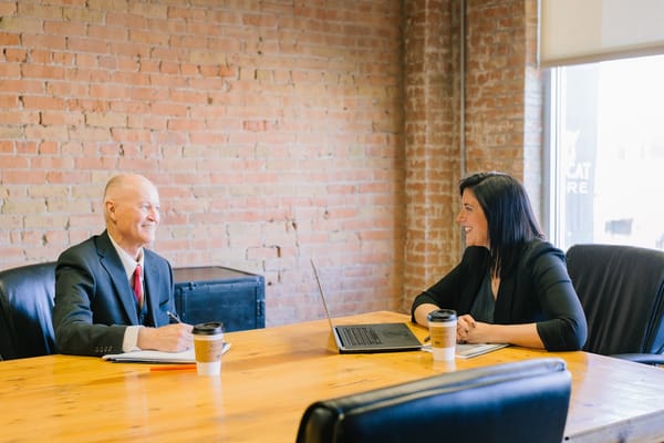 A manager in an informal one-on-one with a team member: leadership as a human relationship, not a control system
