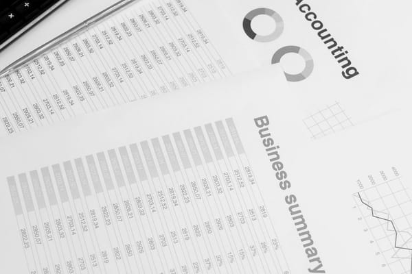 Financial statements and accounting spreadsheets with charts on a desk, used to prepare for a finance interview